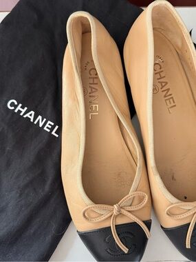 CHANEL Beige Leather Ballet Flats with Black Cap Toe and Bow
